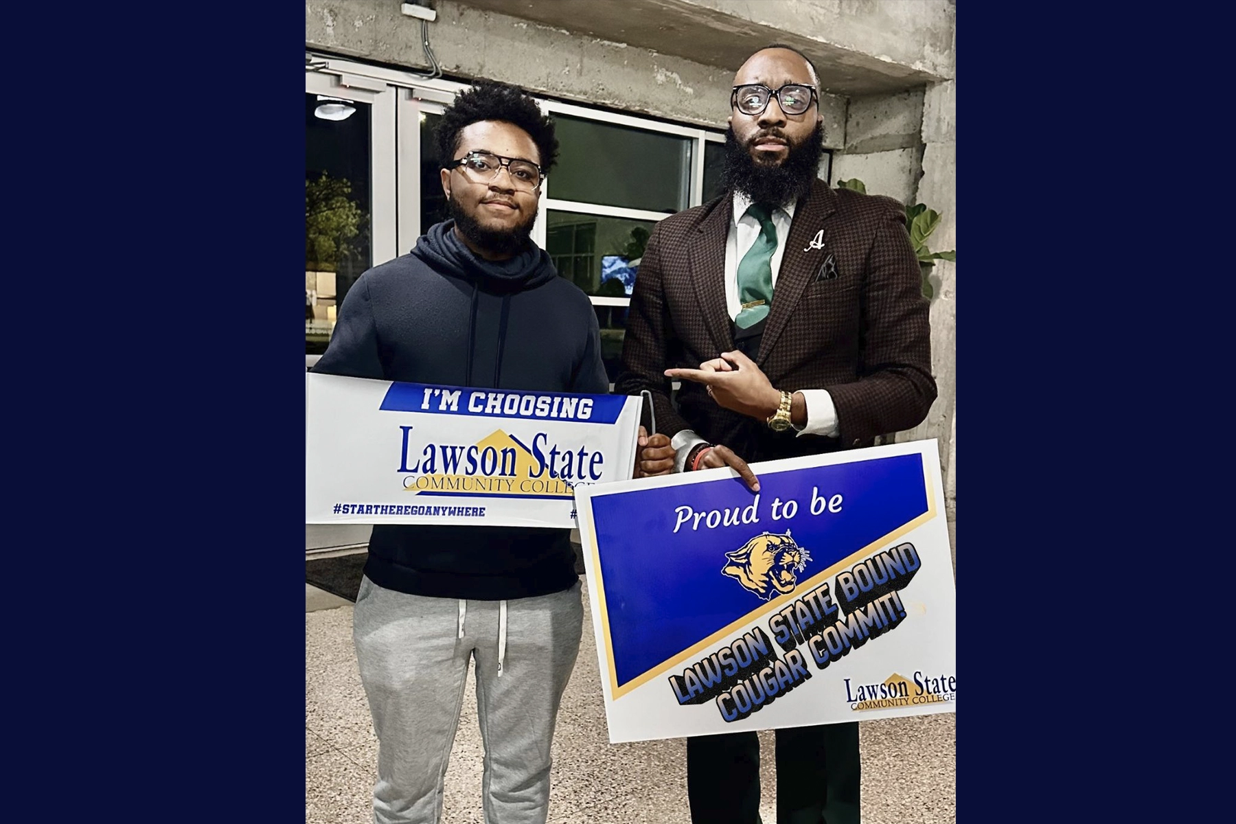 a person holding lawson state logo poster