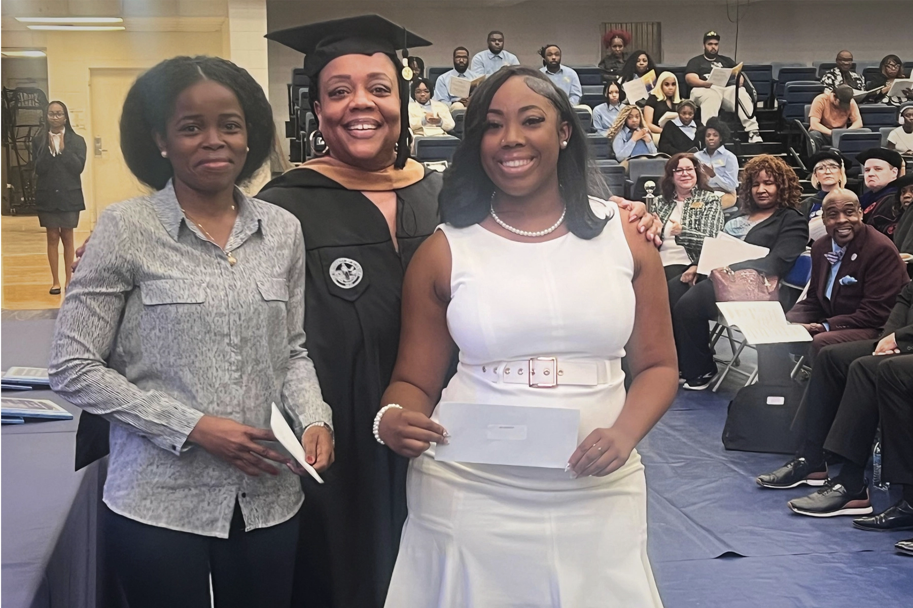 2 student getting scholarship from faculty