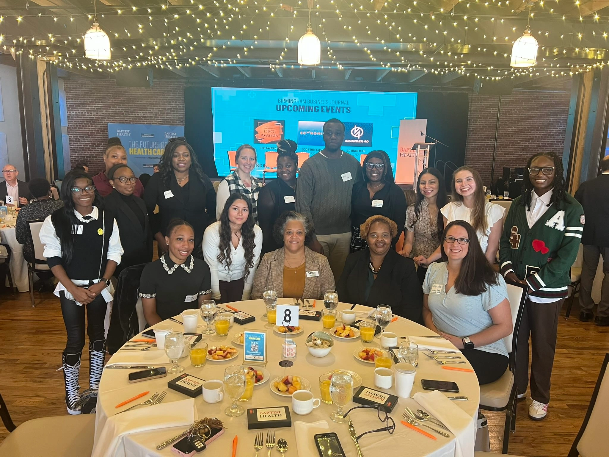 More than a dozen faculty and students from Lawson State health professions programs pose for a group photo at an industry event.