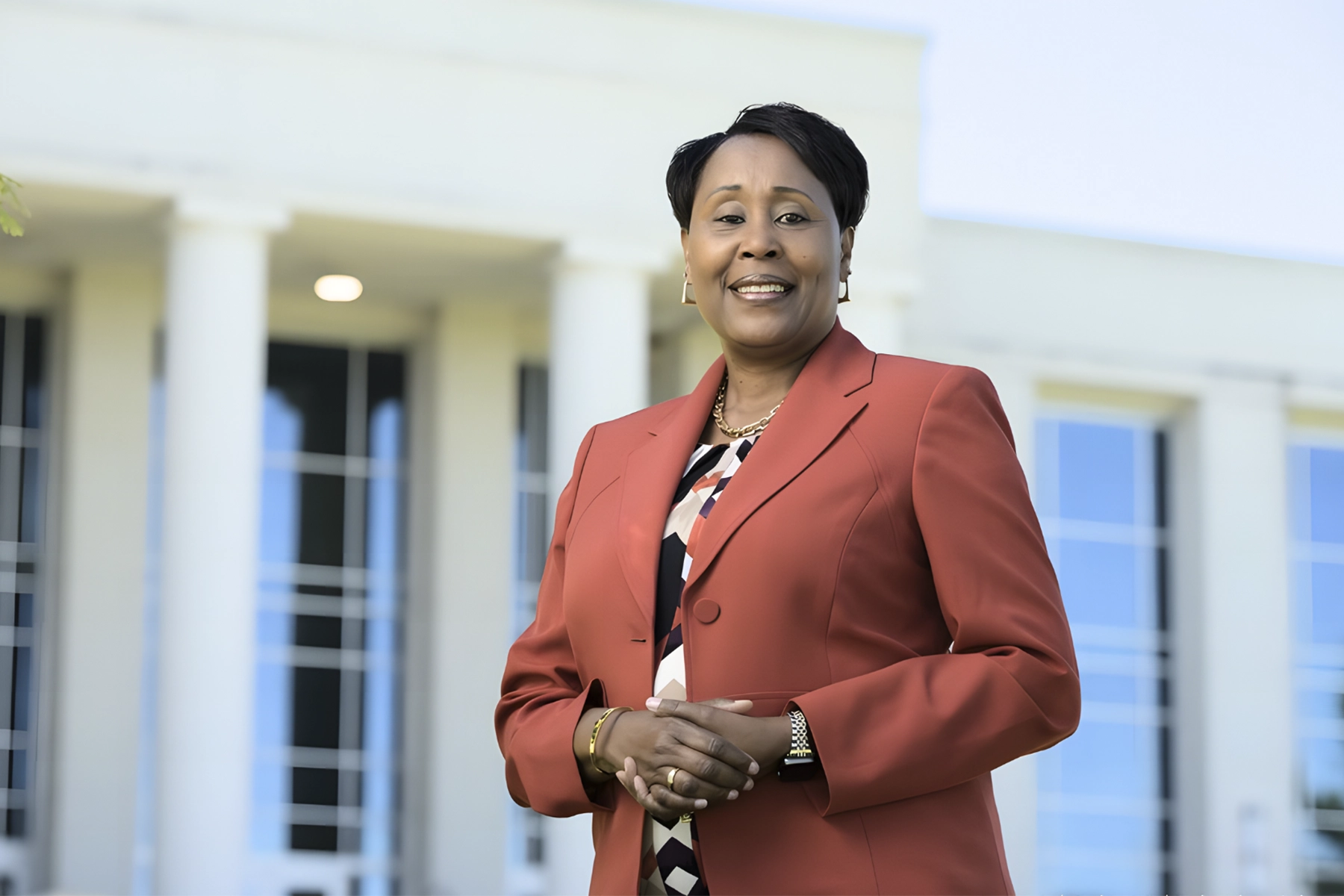 lawson state president wearing red blazer