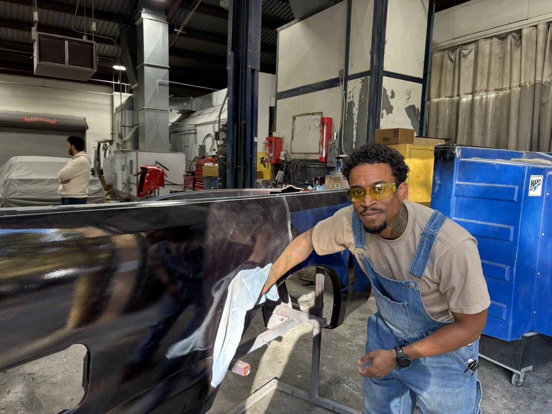 Lawson State student Khalil Saadiq, who is studying auto body and collision repair, looks into the camera after winning $3,000 for his mobile car care detailing business.