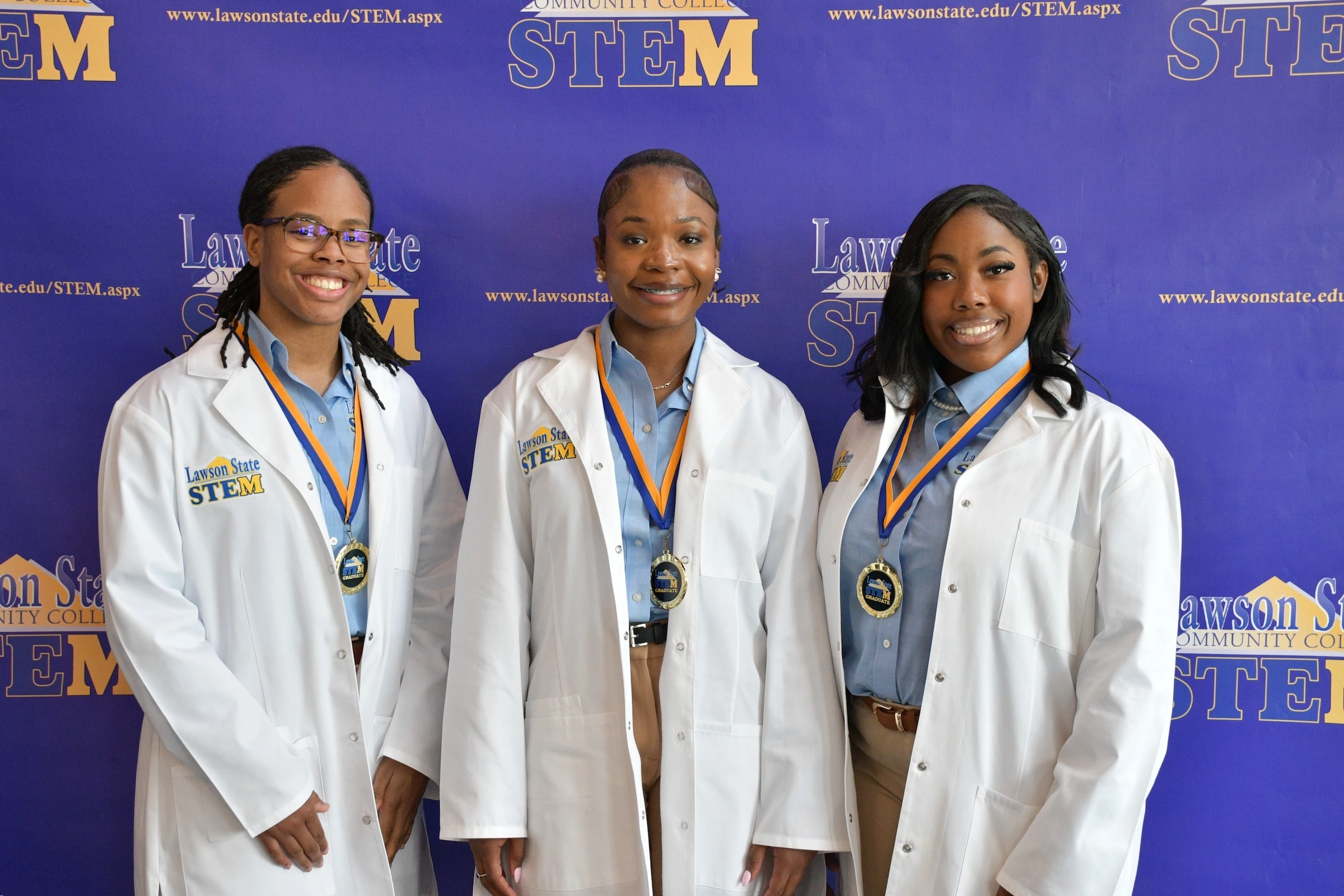 3 nursing student wearing white coat 