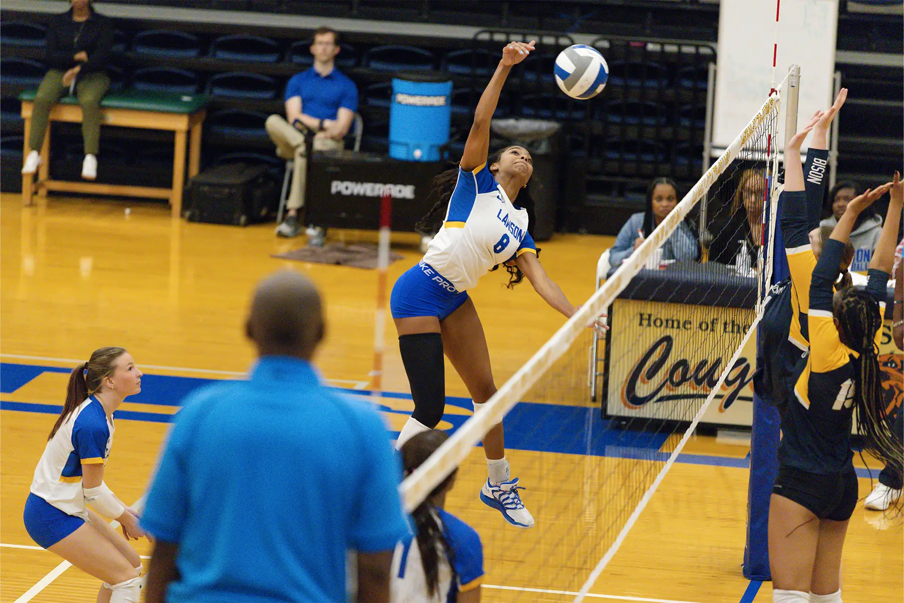 LSCC women's volleyball player smashing ball