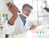 Trainee practices scientific procedures in biotechnician learning lab
